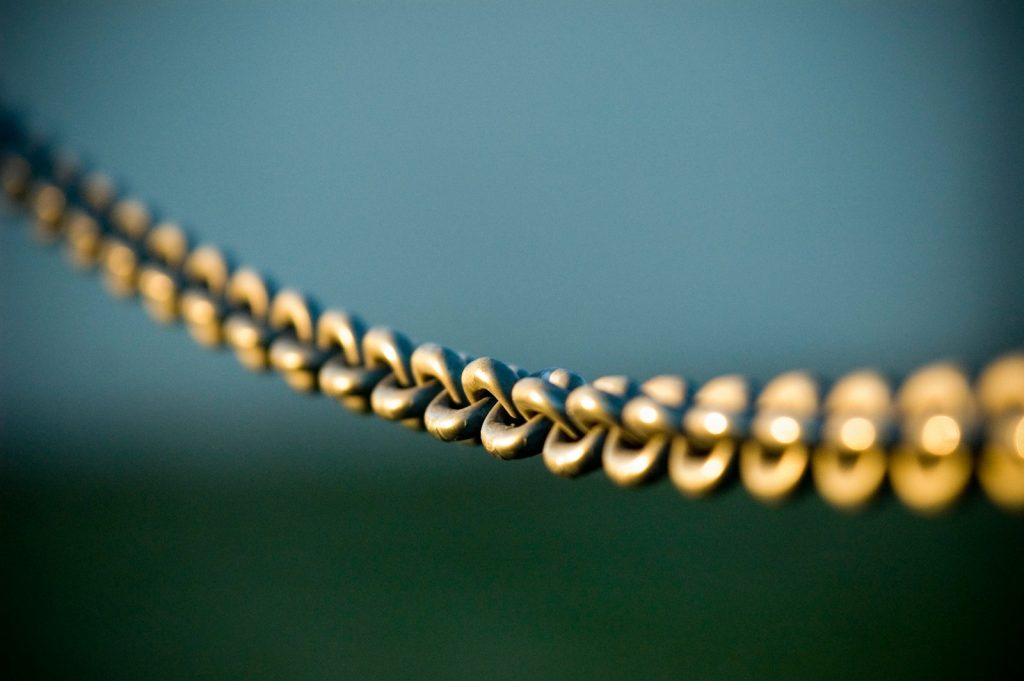 tilt shift photography of gray steel chains